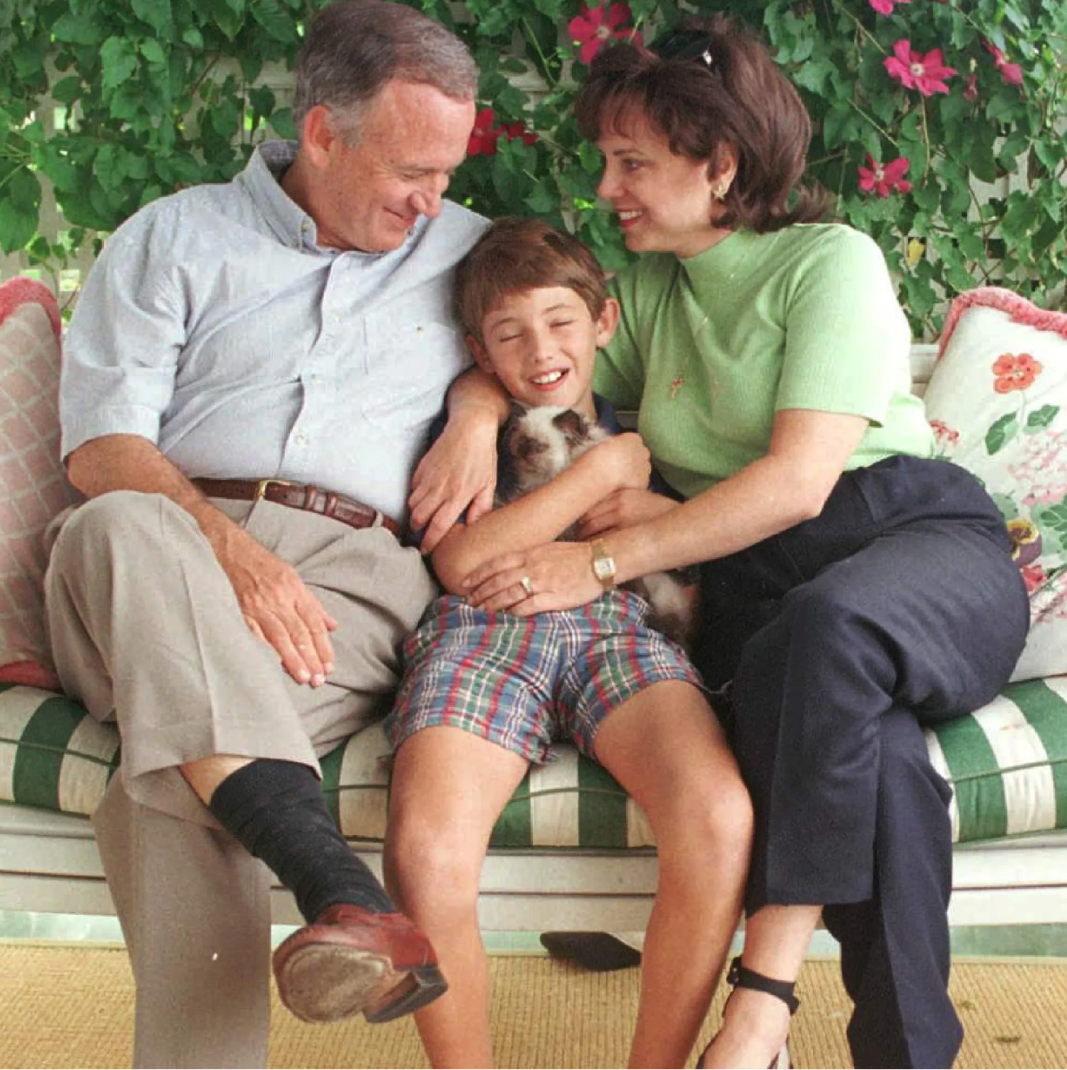 John and Patsy Ramsey on the porch with their 10-Year-Old Son