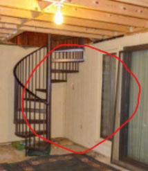 Photo of the Fager basement and spiral staircase is not visible from outside the home